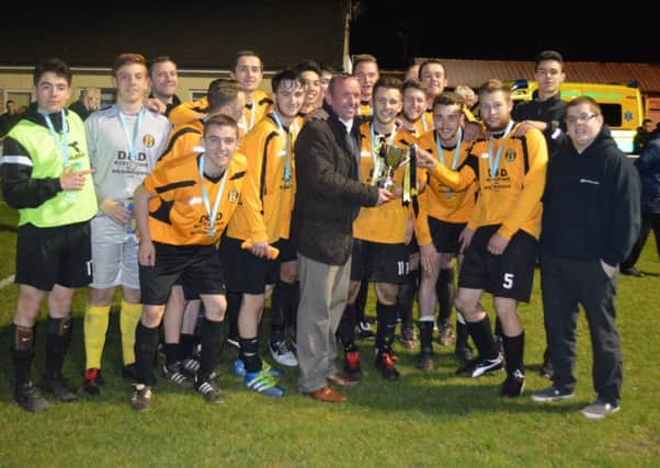 Handsworth Parramore Reserves receive the S&H County FA Association Cup from Iain Kean, managing director of sponsors Fortay Media