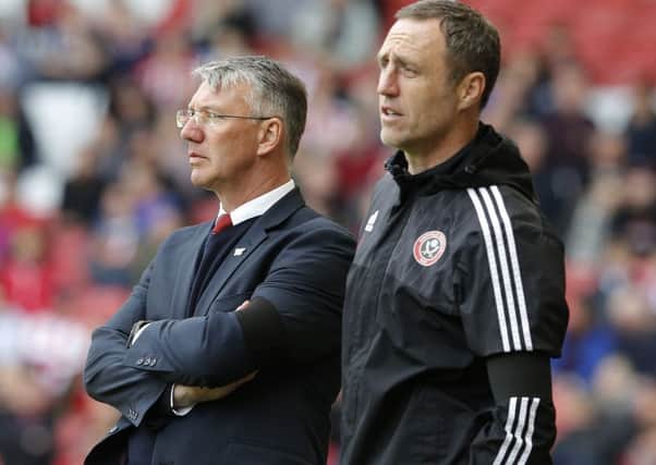 Nigel Adkins manager of Sheffield Utd with assistant Andy Crosby during the Barnsley match