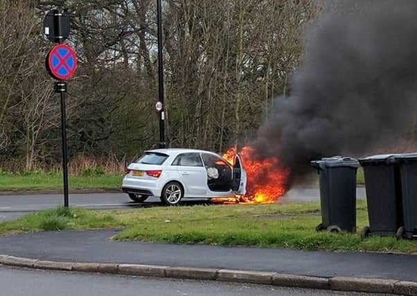 A white Audi A1 caught on fire after a four car crash
Picture: Gary Revill
