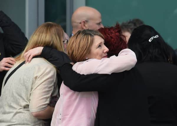Relatives of those who died in the Hillsborough disaster celebrate outside the Hillsborough Inquest in Warrington