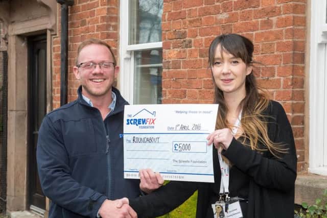 The Screwfix Foundation presenta a cheque to The Roundabout project in SheffieldJohn Nixon presents a Â£5000 cheque to Ruth Gage from Roundabout to renovate some of the living areas