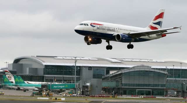 File photo dated 27/01/15 of a British Airways aircraft landing at Dublin Airport, as BA's owner boosted profits on the back of its takeover of Aer Lingus, despite the effects of the Brussels terror attacks. PRESS ASSOCIATION Photo. Issue date: Friday April 29, 2016. International Airlines Group (IAG) said its operating profit jumped more than five times to 155 million euro (Â£121 million) in the three months to the end of March compared with a year ago, boosted by the purchase of Irish flag carrier Aer Lingus completed last September. See PA story CITY IAG. Photo credit should read: Brian Lawless/PA Wire