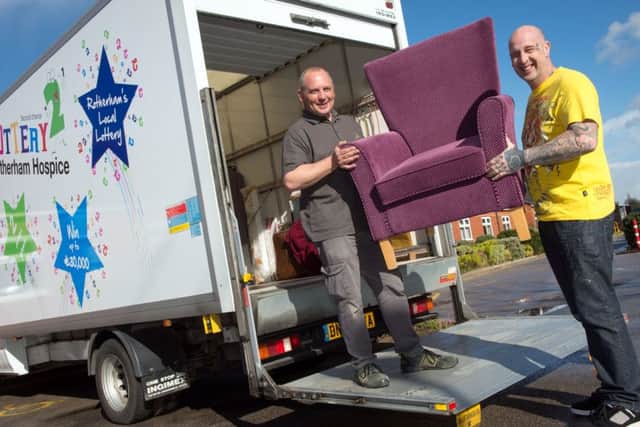 Rotherham Hospice delivery drivers Mark Thompson and Mark Jones loading one of the vans they use to collect and distribute items to the shops