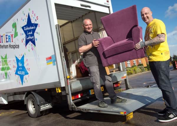 Rotherham Hospice delivery drivers Mark Thompson and Mark Jones loading one of the vans they use to collect and distribute items to the shops
