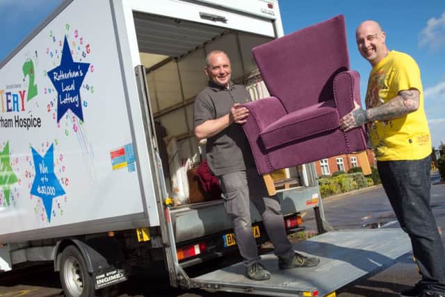 Rotherham Hospice delivery drivers Mark Thompson and Mark Jones loading one of the vans they use to collect and distribute items to the shops