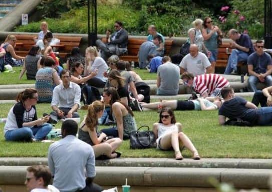 People enjoying last week's hot weather in the Peace Gardens in Sheffield