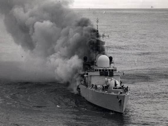HMS Sheffield ablaze in the South Atlantic in May 1982.