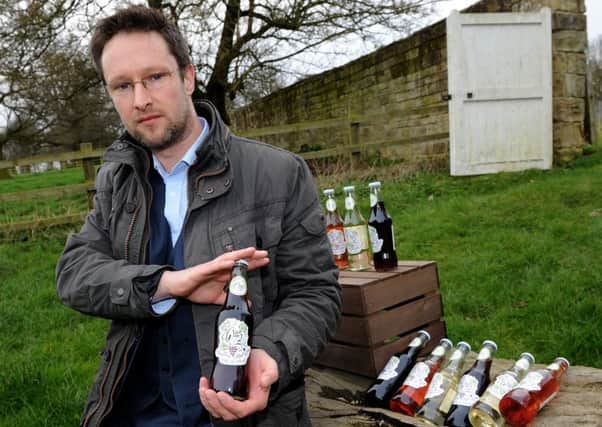 Matt Thompson with bottles of sparkling wine which has been made at Renishaw Hall. Picture: Andrew Roe