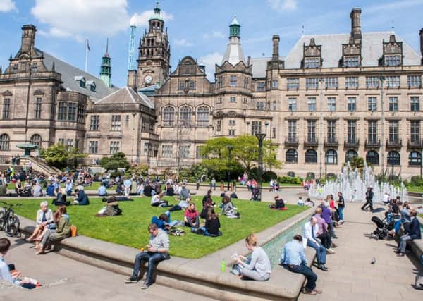 Office workers lunch al fresco in Sheffield's Peace Gardens as the temperatures rose to 20 degrees Celsius
Picture Dean Atkins