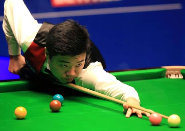 Ding Junhiu in action during the final at the Crucible in Sheffield