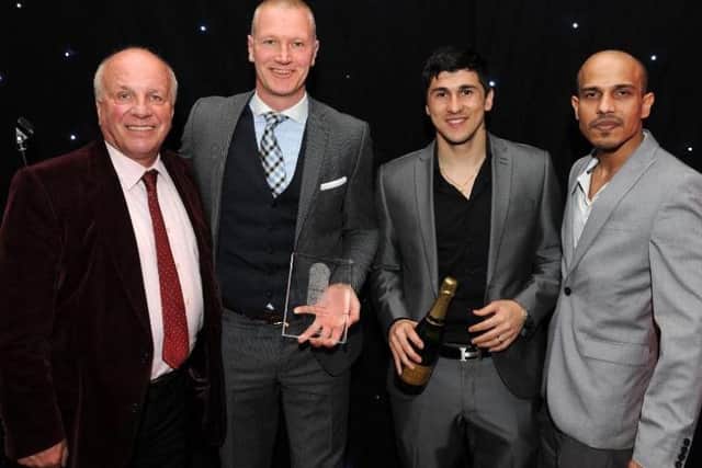Lee Bullen and Fernando Forestieri, who was The Star's Sheffield Wednesday Player of the Year, receive the Owls team award from sponsors Greg Dyke and Allam Shah