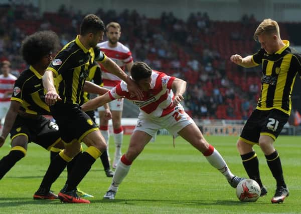 Tommy Rowe tries to get through the Burton defence
