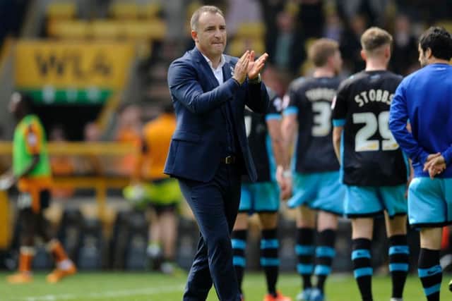 Carlos Carvalhal applauds the traveling fans at Molineux