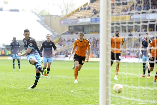 Lewis McGugan scores from the spot