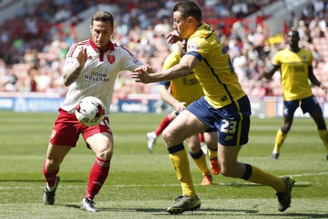 Billy Sharp up against Murray Wallace