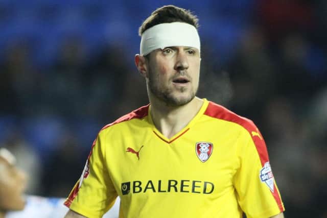 Richard Wood doesn't go anywhere without his head bandage