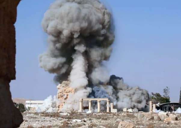 An image released by Islamic State of smoke from the detonation of the 2,000-year-old temple of Baalshamin in Syria's ancient caravan city of Palmyra.