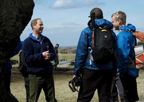 The Earl of Wessex talking to participants by the rocks at Kinder Low  during the Duke of Edinburgh Award Scheme 'Diamond Challenge' day on Kinder Scout ...(National Trust photo by David Bocking: free use for stories relating to National Trust work in the Peak District)