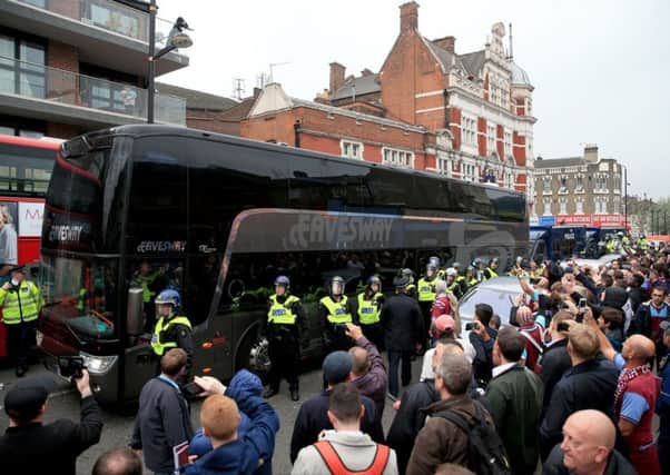 The Manchester United team coach makes its way to Upton Park before the Barclays Premier League match at Upton Park. Photod: Nick Potts/PA Wire.