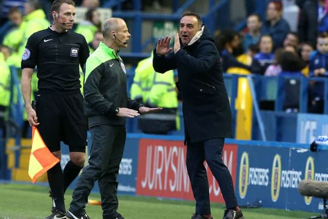 Sheffield Wednesday manager Carlos Carvalhal speaks with the fourth official on the touchline during the playoff. Pic: Martin Rickett/PA Wire.