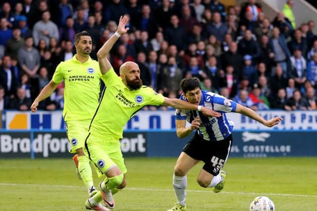 Brighton's Bruno and Sheffield Wednesday's Fernando Forestieri (right) battle for the ball during the Sky Bet Championship playoff, Semi final, first leg match at Hillsborough, Sheffield. Pic by Martin Rickett/PA Wire.