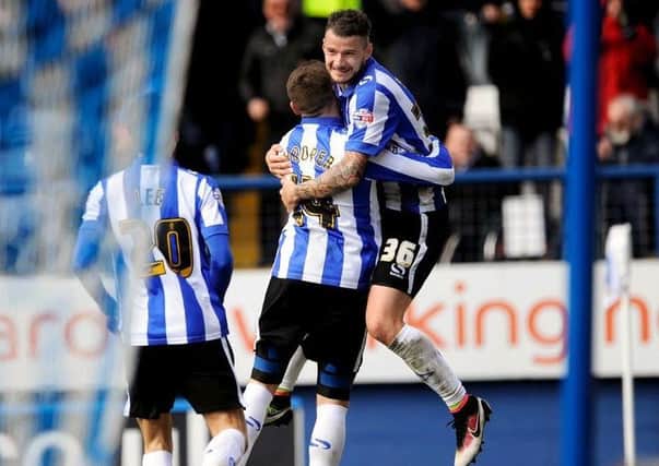 Daniel Pudil celebrates with Gary Hooper after the striker scored against Cardiff