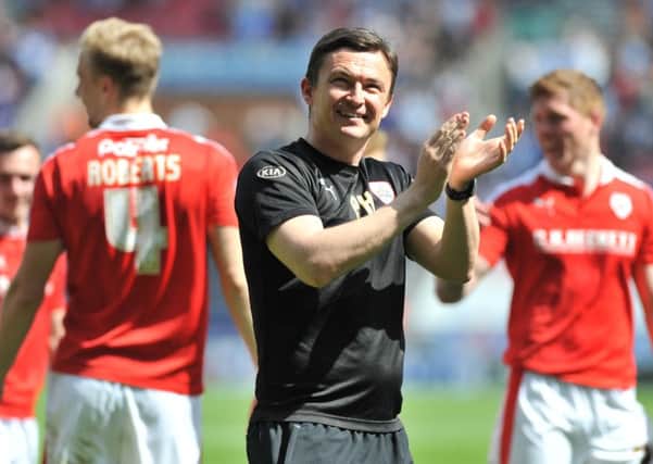 Barnsley's caretaker manager Paul Heckingbottom appaluds the travelling Reds fans.