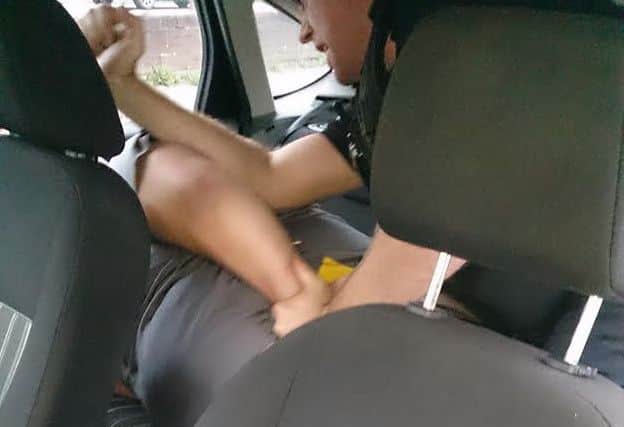 The incident in the police car involving Russell Hartley, who was wrongly jailed for assaulting a police officer