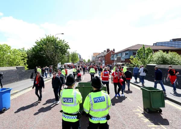 Police at Old Trafford. Image: Martin Rickett/PA Wire.