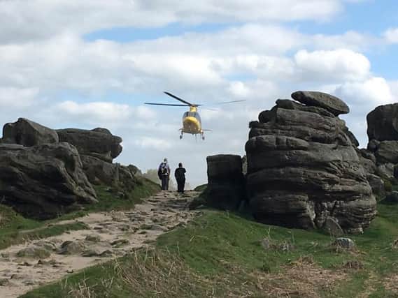 An air ambulance was called to help an injured climber at Froggatt Edge