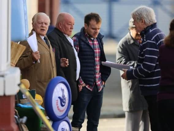Tim Healy (second left) filming Still Open All Hours in Balby with Sir David Jason. (Photo: Ross Parry).