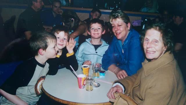 Neighbours in one city neighbourhood have raised more than Â£3,000 to help three brothers pay for a funeral for their mother, who died of cancer. From left to right, brothers Kyle, Jamie, Jordan, with mum Michelle  and grandma Kathleen