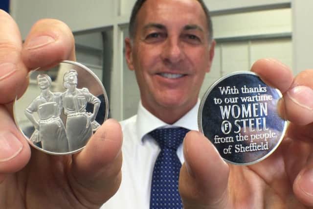 Assay Master Ashley Carson shows of the Women Of Steel medals.