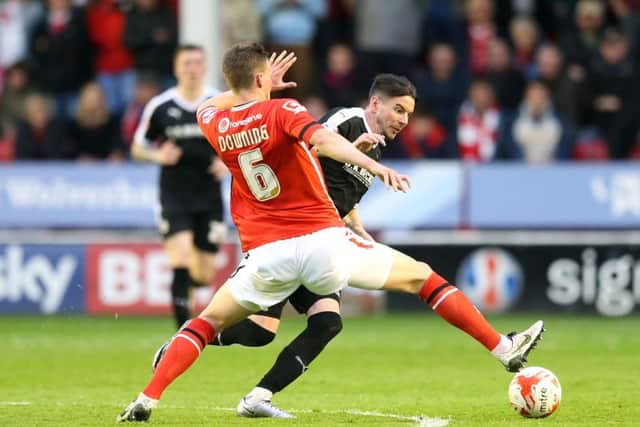 Walsall's Paul Downing (left) and Barnsley's Adam Hammill battle for the ball  PRESS ASSOCIATION Photo