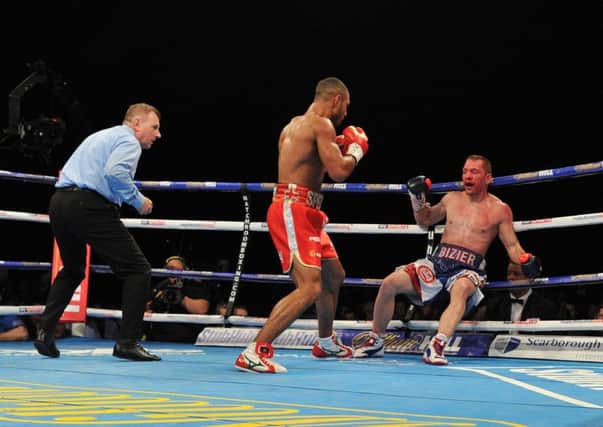 Kell Brook has Canadian Kevin Bizier on the ropes. Picture by Dean Wooley