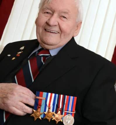 Wartime airman Ken Johnson, aged 90, of Balby, with his medals.