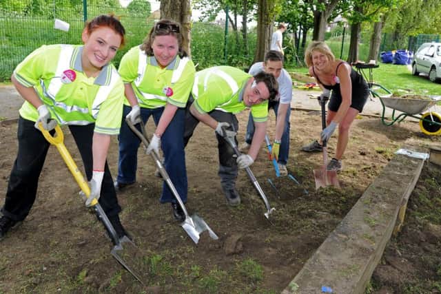 (l-r) Lea Pecorari, Helen Maplas, Sam Green, of Carillion, Dale Rowley, of Irwin Mitchell and Bev Brooke, of Best Solicitors dig to make way for a sensory garden at a Give and Gain Charity Day at Mansel Primary School. Picture: Andrew Roe
