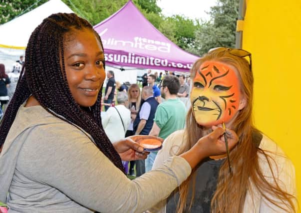 Latoya Ellis, of Funky Faces, pictured painting student Lorna Sinclair.Picture: Marie Caley NSST Weston Park MC 1