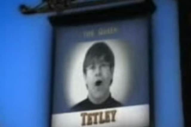 Sir Elton John's face super-imposed on the sign of The Queen pub. (Photo: YouTube).