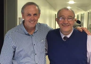 Sports reporter Steve Hossack (left) catches up with former Dons head coach Tony Fisher.