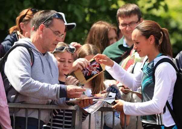 Jessica Ennis-Hill signs autographs after competing in the women's javelin at Loughborough. Photo: Mike Egerton/PA