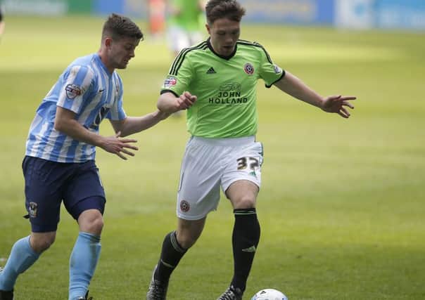 Aaron Phillips, pictured in action against Sheffield Uniteds Graham Kelly, could emerge as a target for new Blades boss Chris Wilder this summer