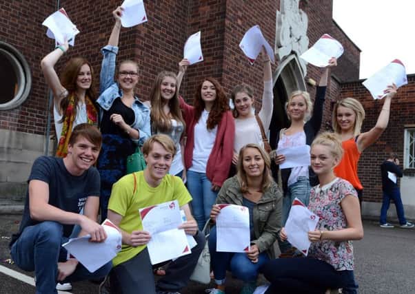 Doncaster's Hall Cross pupils with their A level result papers.