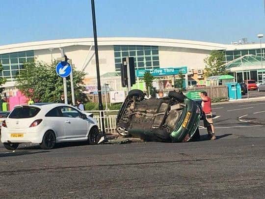 An overturned car in Handsworth Road, Sheffield