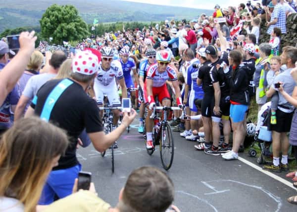Tour de France in North Sheffield: The leading group race down Church Street, Oughtibridge