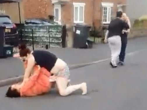 The video shows four women fighting and arguing in two separate brawls.