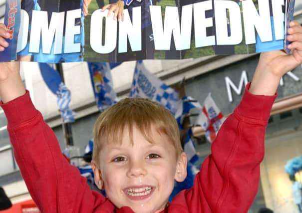 Young Wednesday fan Liam Peel aged 4 holding his Sheffield Wednesday clapper free with The Star