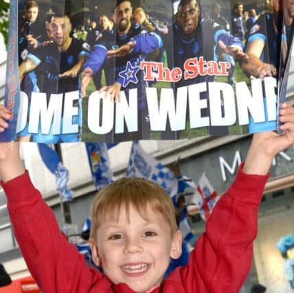 Young Wednesday fan Liam Peel, aged four, holding his Sheffield Wednesday clapper - free with The Star