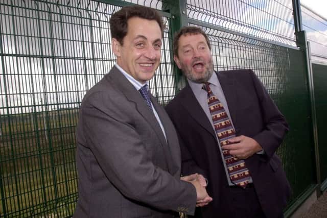 David Blunkett (right) meets French interior minister Nicolas Sarkozy near the Frethun freight terminal in Calais, France, Thursday September 26, 2002,  where they inspected a new multi-million pound fence designed to deter asylum seekers from boarding trains to Britain.