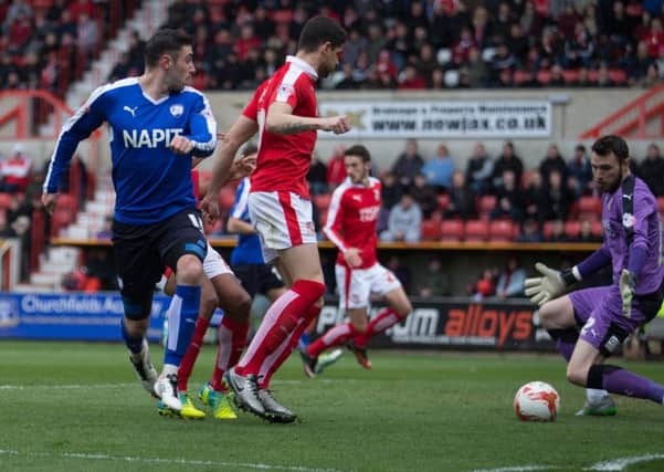Swindon Town vs Chesterfield - Lee Novak's flick is stopped by Jake Kean - Pic By James Williamson